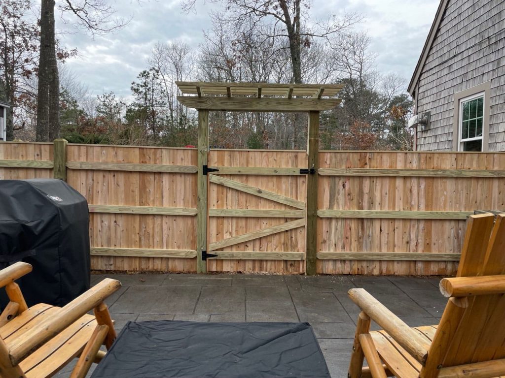 6 foot cedar board with top cap and pergola - Privacy 50